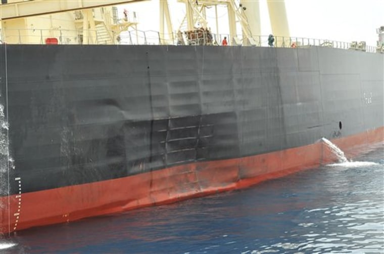 In this photo released by the Emirates News Agency (WAM), damage is seen on the side of the 'M. Star' oil supertanker offshore Fujairah port in the United Arab Emirates Thursday, July 29, 2010.  The chief official at the port where a Japanese tanker was docked a day after it was damaged at the mouth of the Persian Gulf said Thursday investigators now believe the ship was involved in a collision, backing away from an earlier theory that natural causes were to blame. But the ship's owner refused to speculate on what had set off Wednesday's incident, which it described as an explosion on the tanker, until it had more information. The company initially said it suspected the ship had been attacked as it entered the tense Strait of Hormuz. The possibility of a deliberate attack has not been ruled out. (AP Photo/Emirates News Agency)